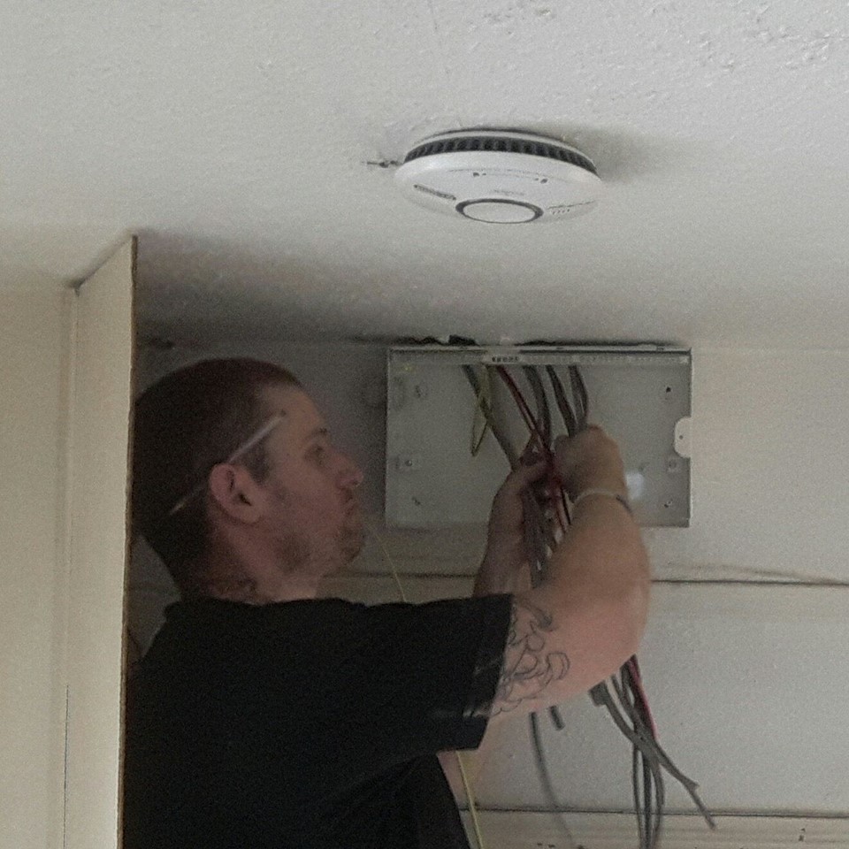 Electrician changing a fuse board in Bristol